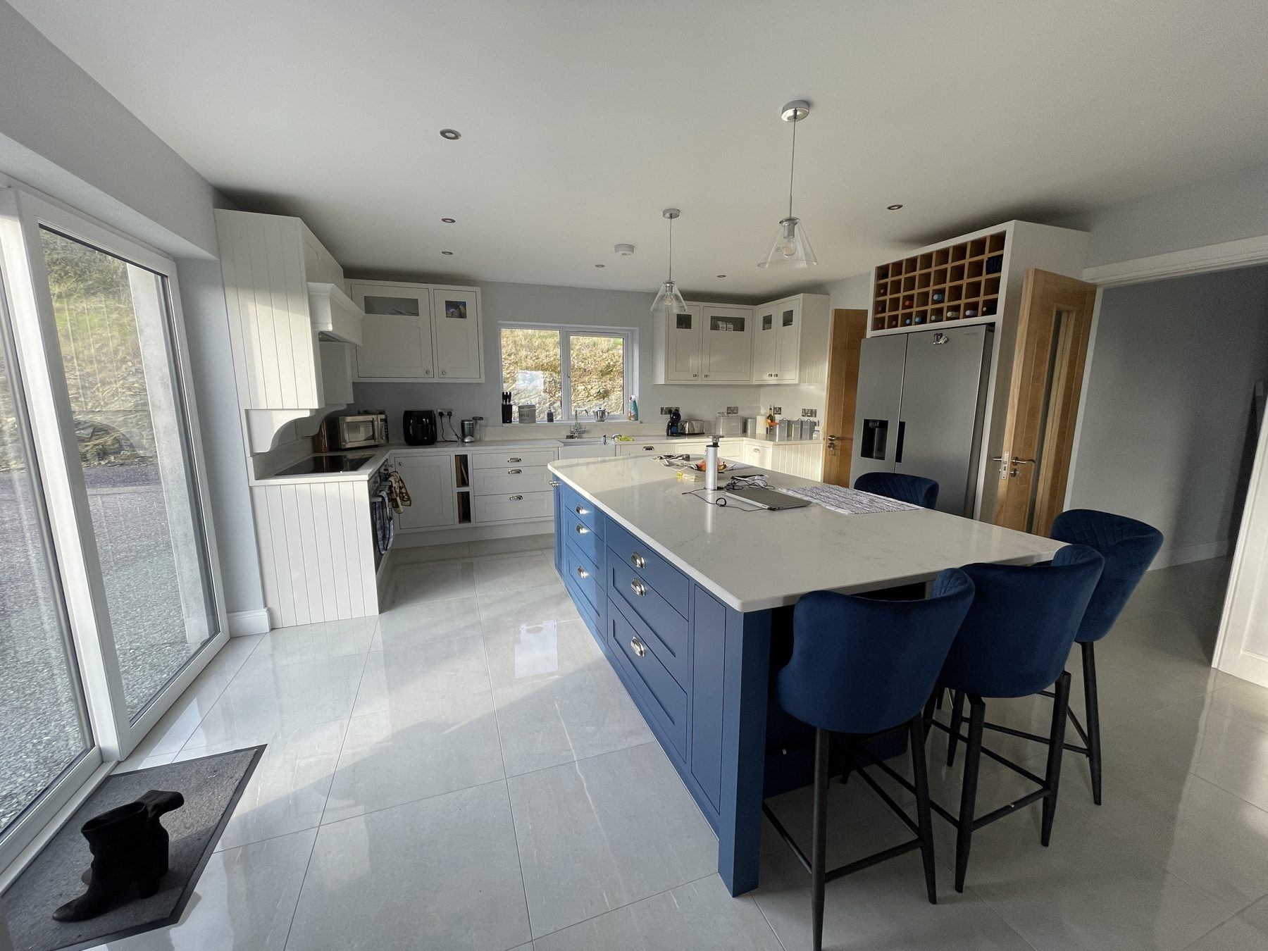 White shaker kitchen with a blue island (finished) - fitted by Kitchen Hero