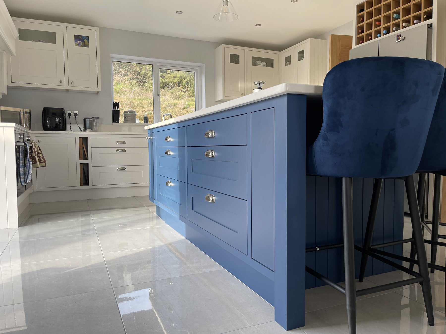 White shaker kitchen with a blue island (finished) - fitted by Kitchen Hero