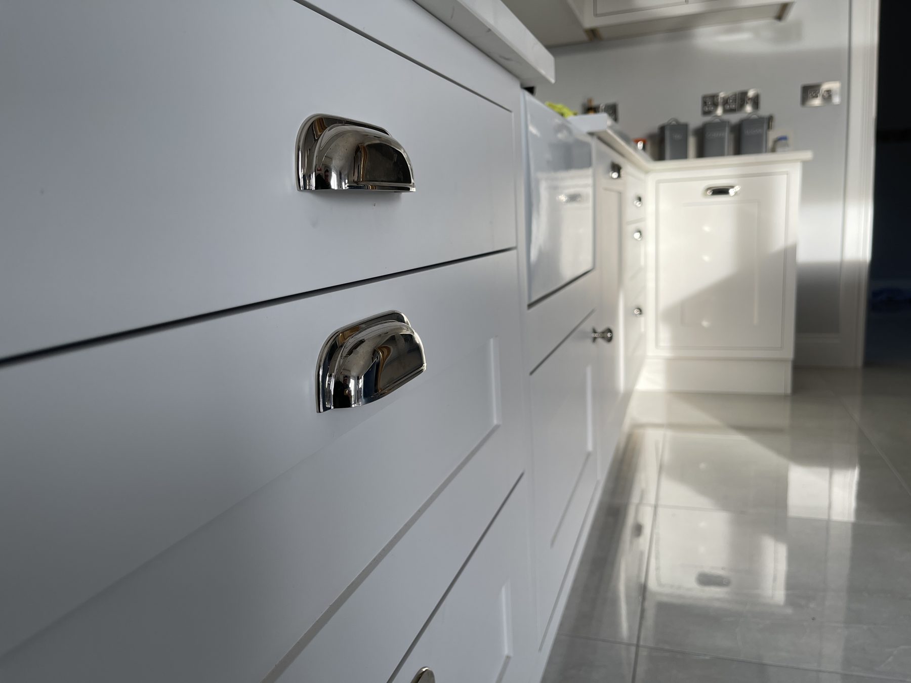 White shaker kitchen with a blue island (finished) - fitted by Kitchen Hero