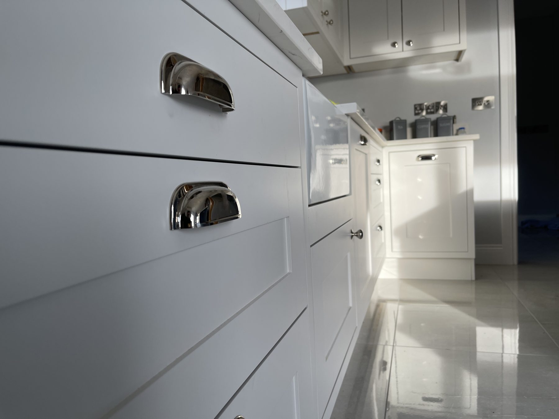 White shaker kitchen with a blue island (finished) - fitted by Kitchen Hero