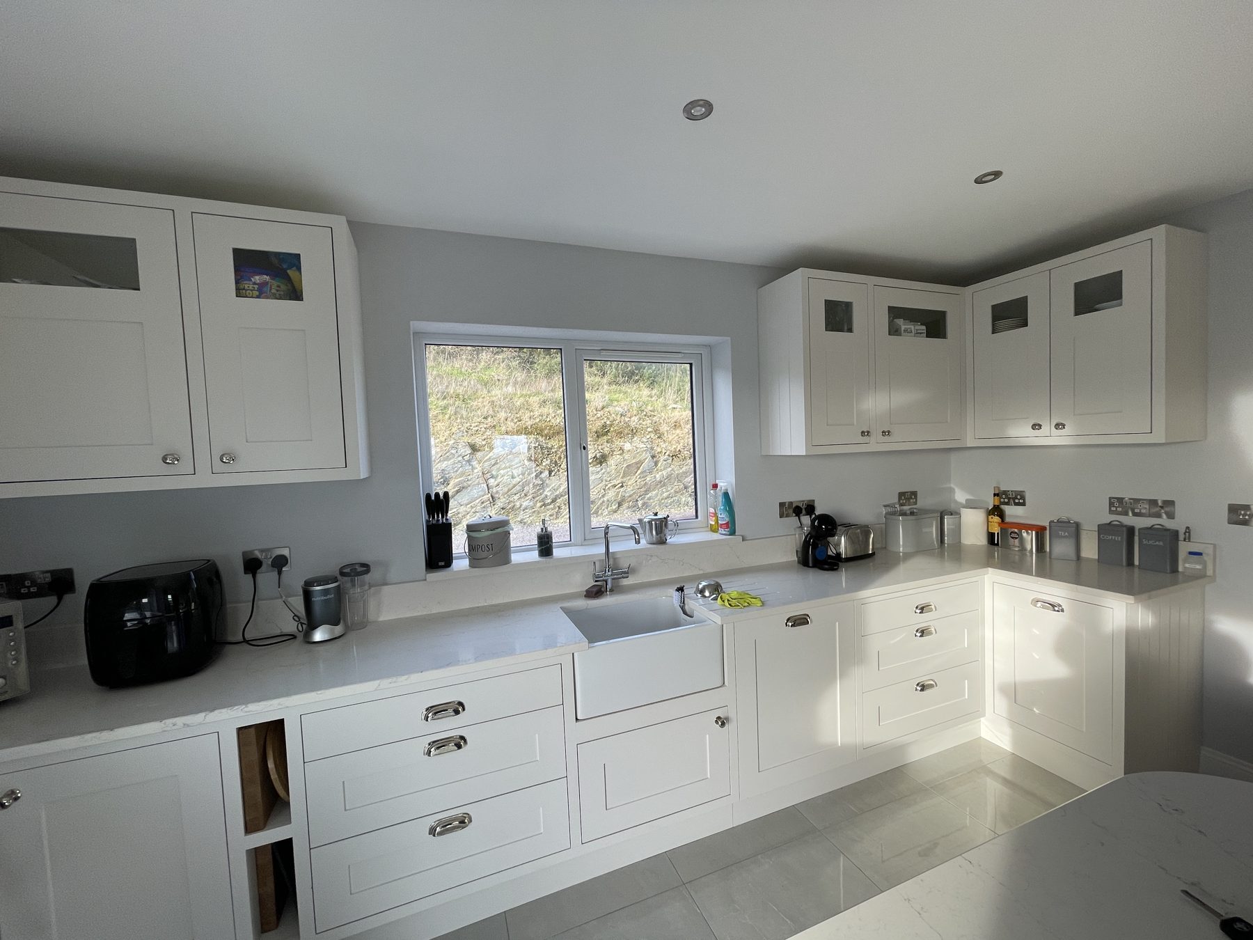 White shaker kitchen with a blue island (finished) - fitted by Kitchen Hero