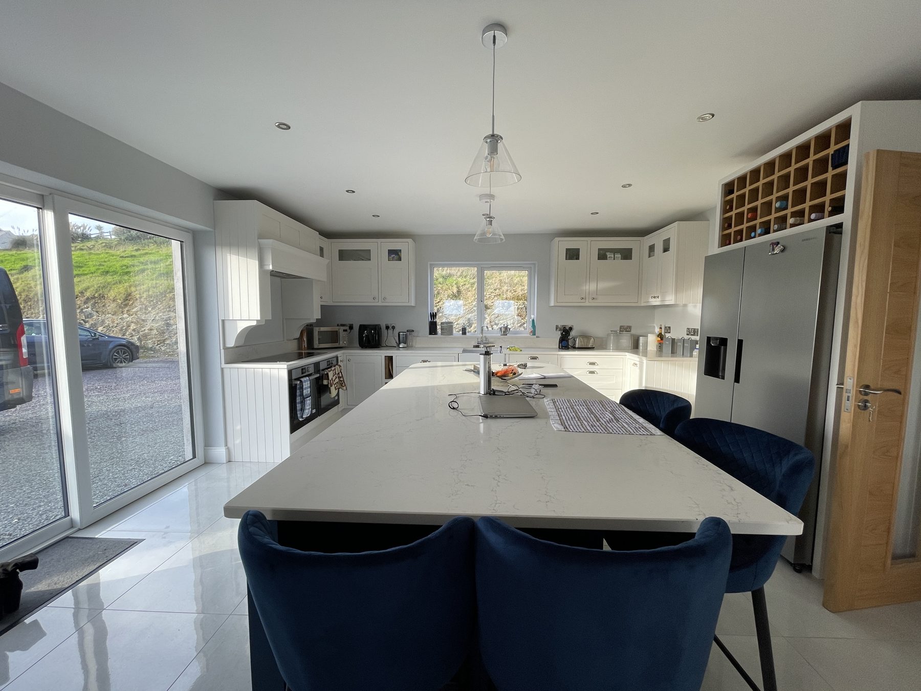 White shaker kitchen with a blue island (finished) - fitted by Kitchen Hero