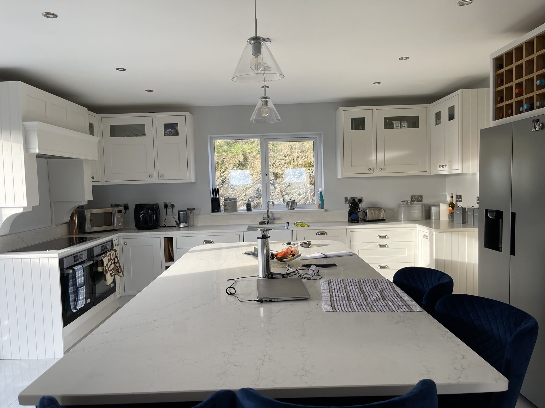 White shaker kitchen with a blue island (finished) - fitted by Kitchen Hero