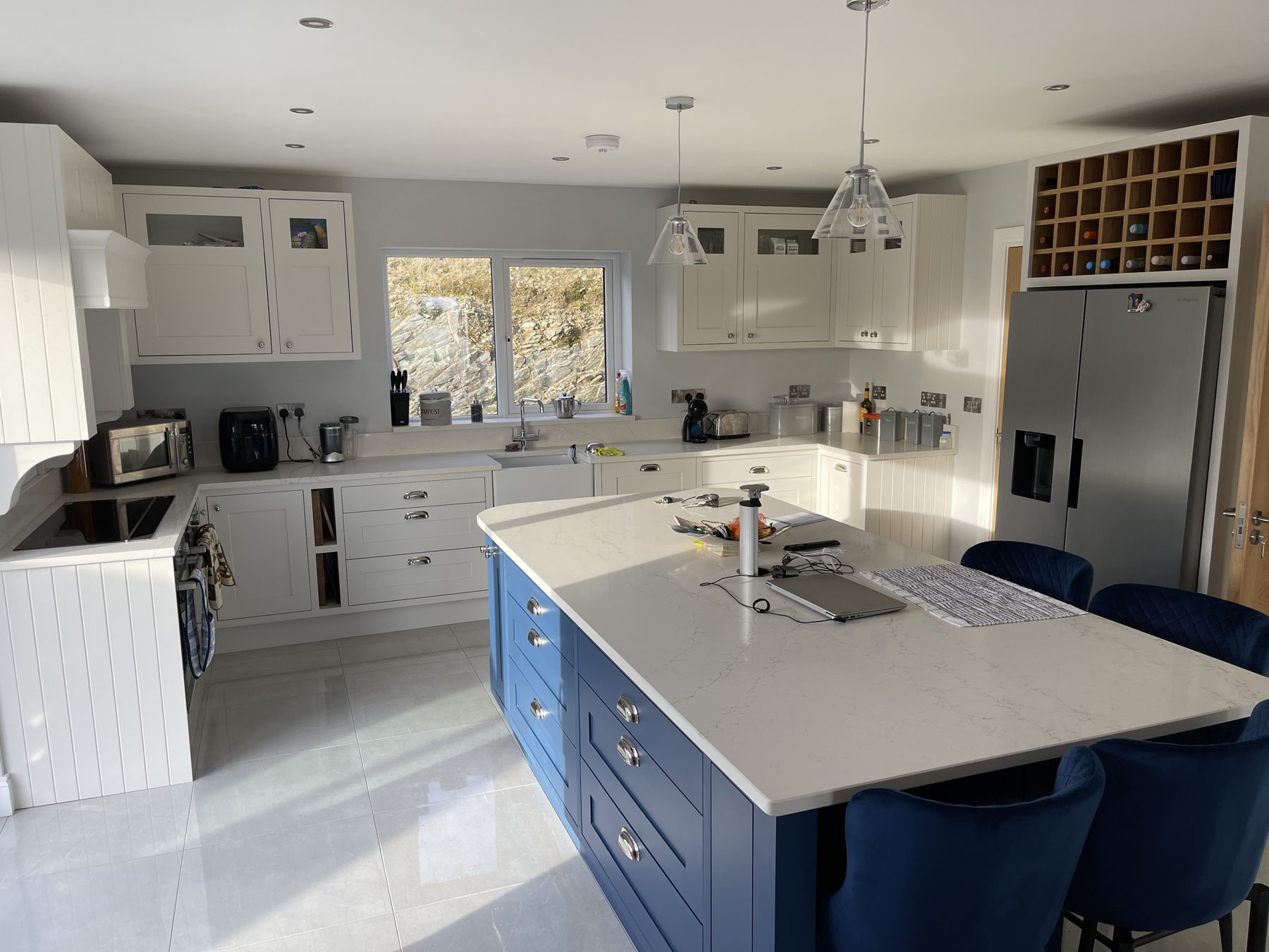 White shaker kitchen with a blue island (finished) - fitted by Kitchen Hero