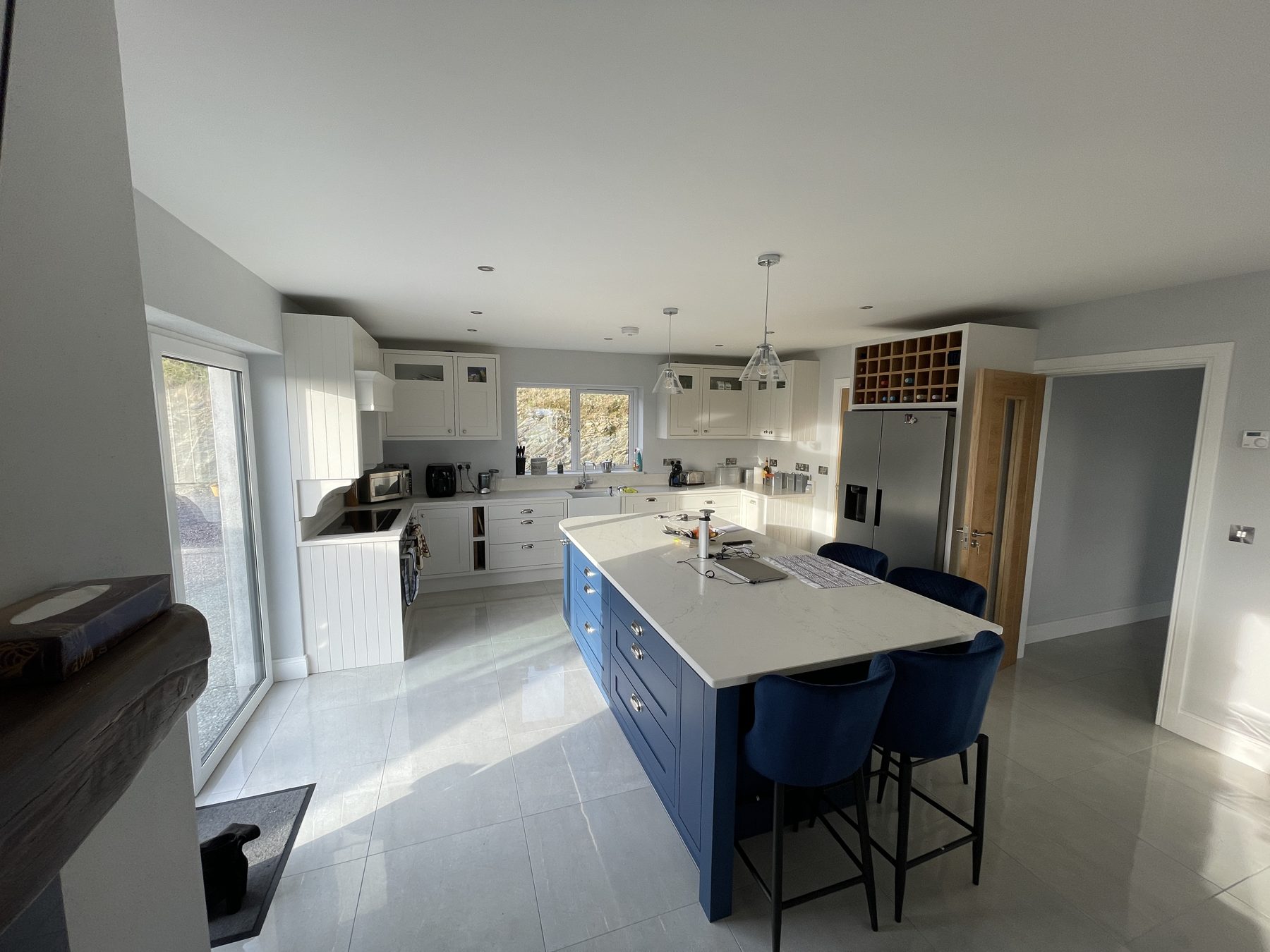 White shaker kitchen with a blue island (finished) - fitted by Kitchen Hero