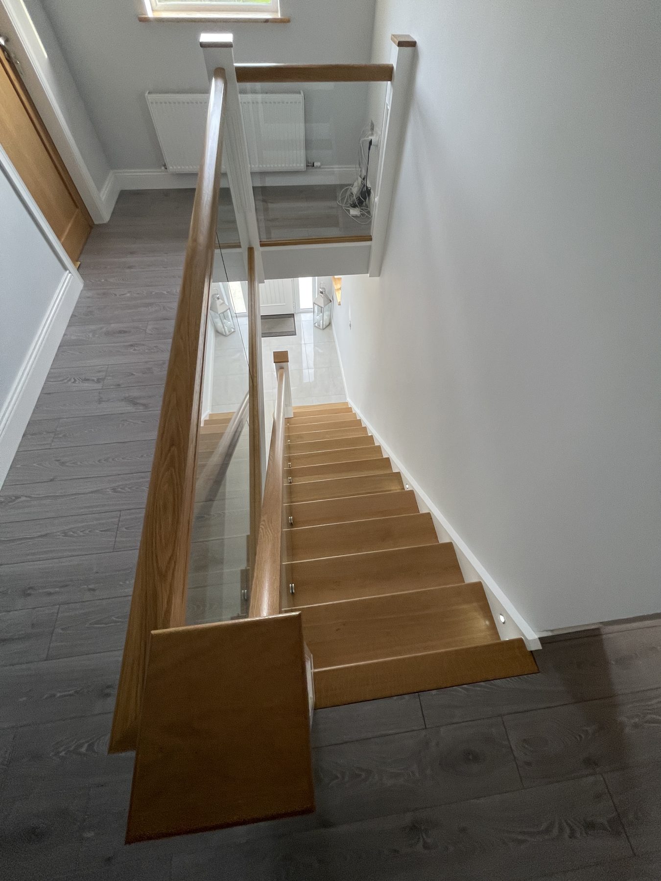 Oak and glass staircase Oak and glass staircase (finished) - fitted by Kitchen Hero