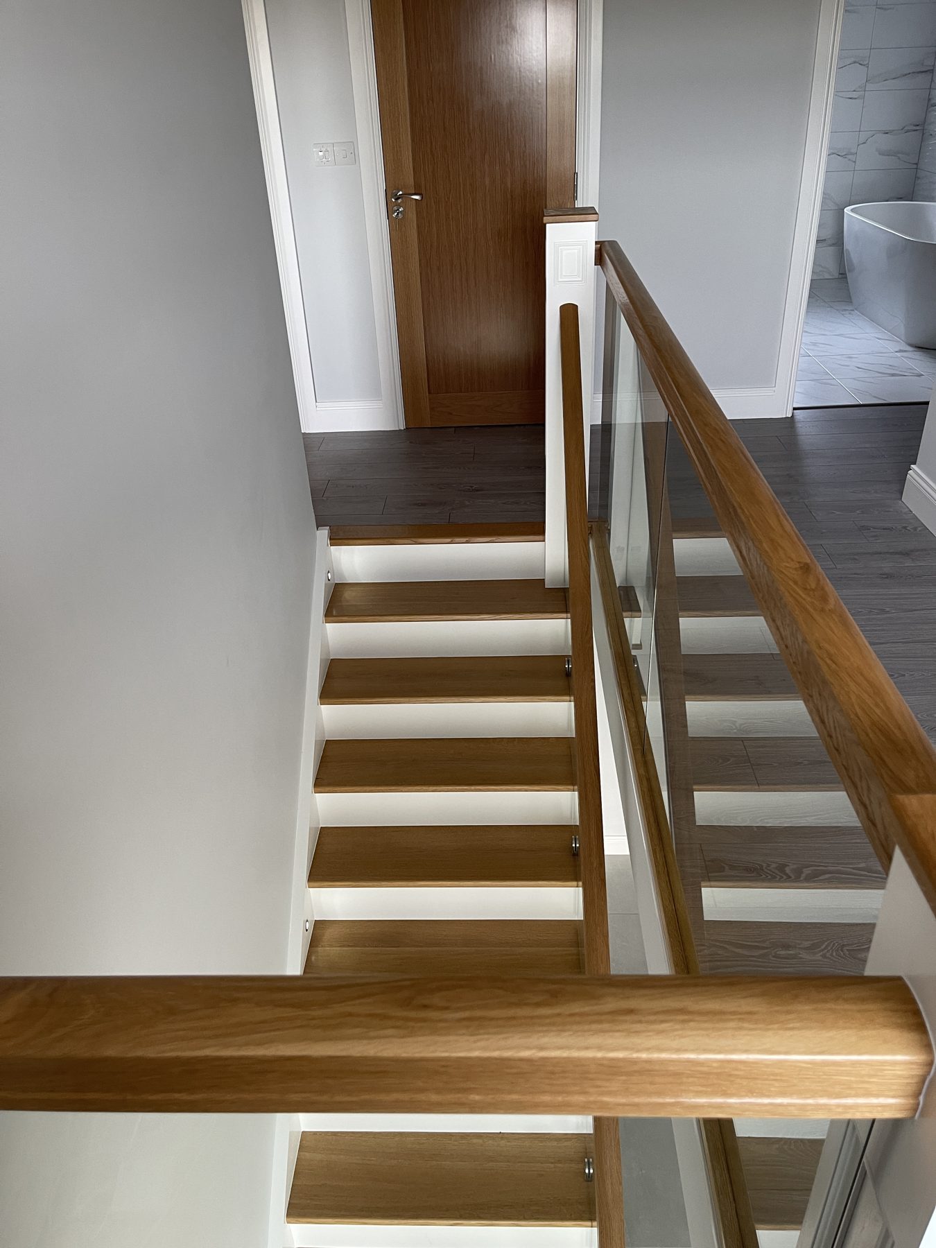 Oak and glass staircase Oak and glass staircase (finished) - fitted by Kitchen Hero