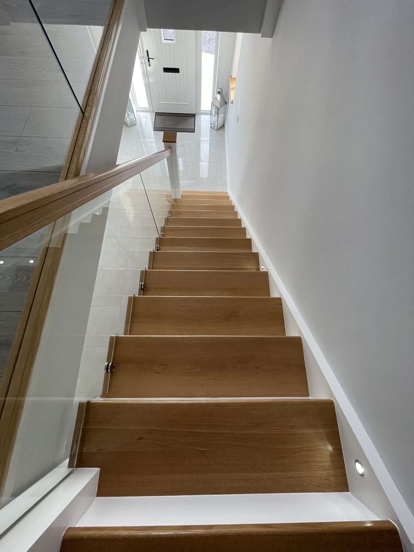 Oak and glass staircase Oak and glass staircase (finished) - fitted by Kitchen Hero