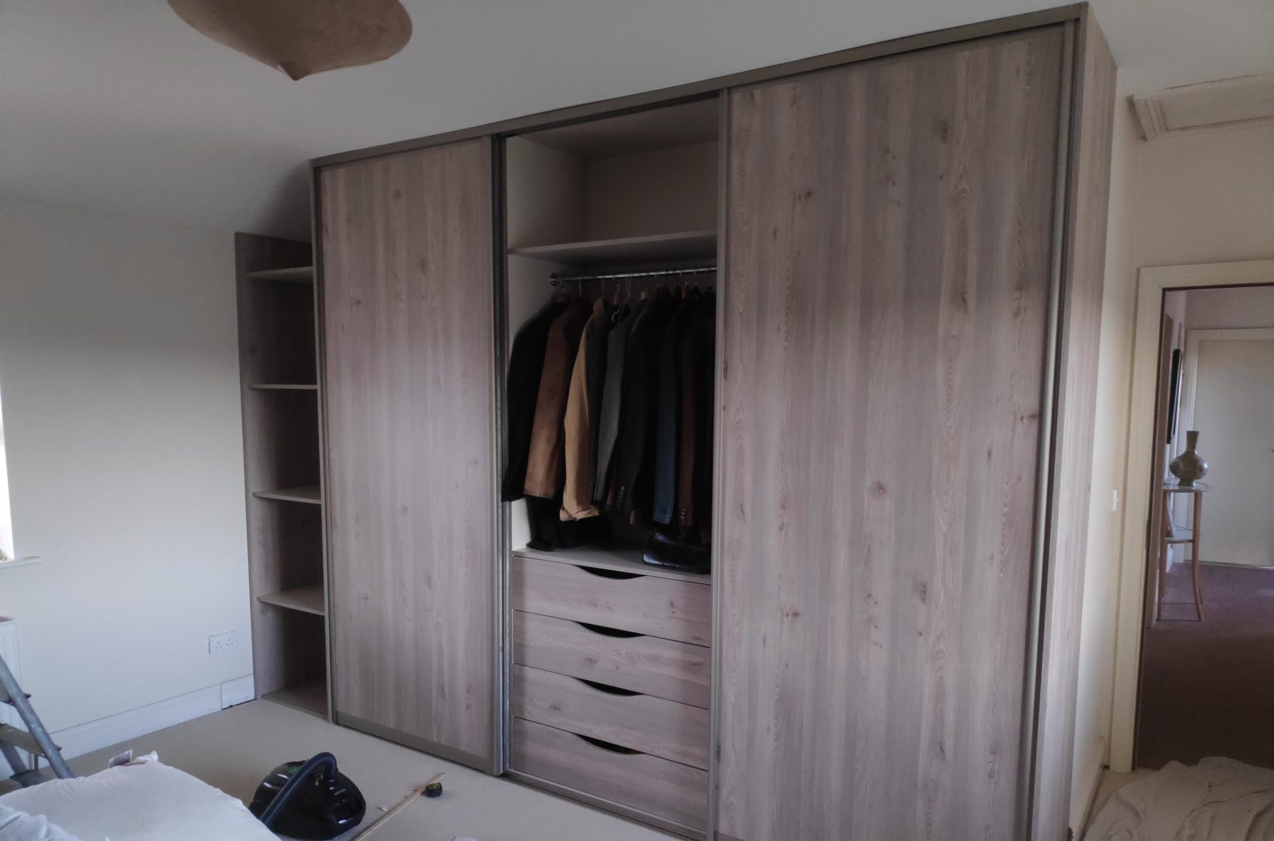 Oak sliding wardrobe under the slope Oak sliding wardrobe under the slope (finished) - fitted by Kitchen Hero