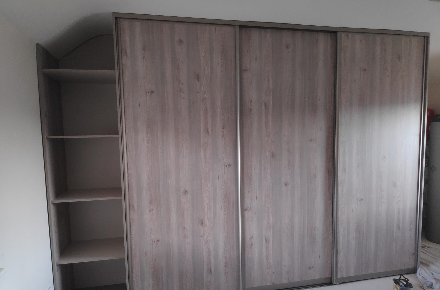 Oak sliding wardrobe under the slope (finished) - fitted by Kitchen Hero