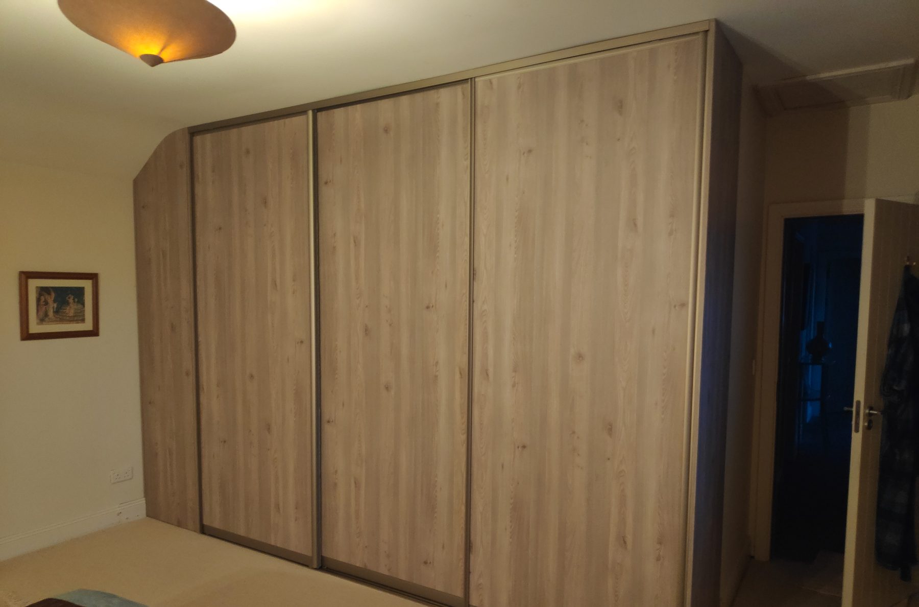 Oak sliding wardrobe under the slope (finished) - fitted by Kitchen Hero
