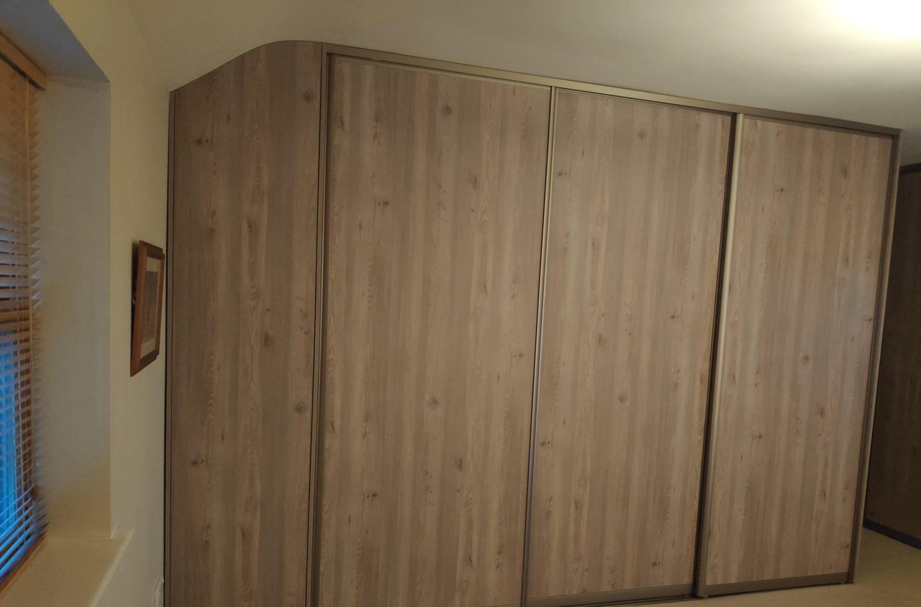 Oak sliding wardrobe under the slope Oak sliding wardrobe under the slope (finished) - fitted by Kitchen Hero