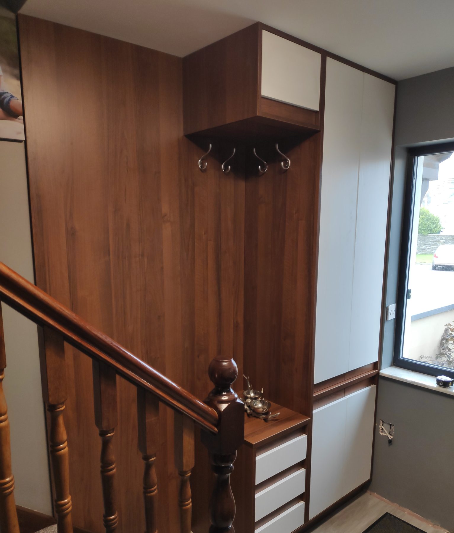 Walnut coat unit on the landing (finished) - fitted by Kitchen Hero