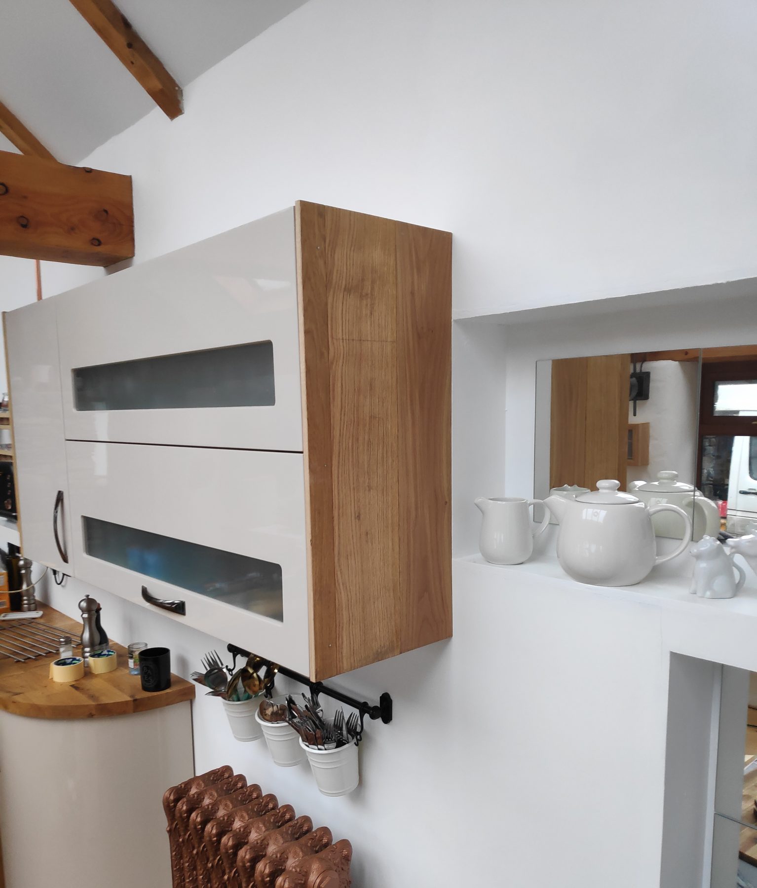 Gloss wall cabinet with an oak surround (finished) - fitted by Kitchen Hero