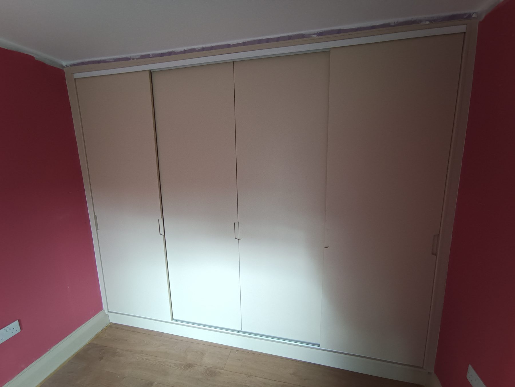 White sliding wardrobe (finished) - fitted by Kitchen Hero