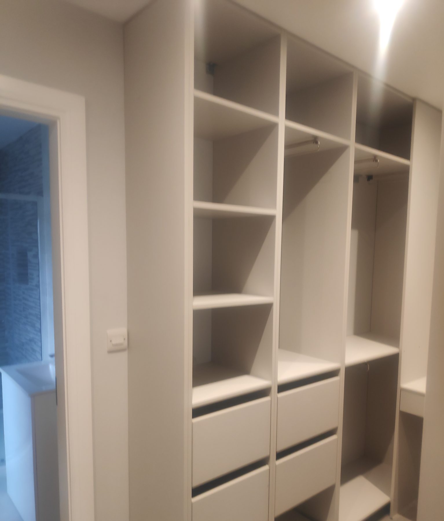 White walk-in wardrobe White walk-in wardrobe (finished) - fitted by Kitchen Hero