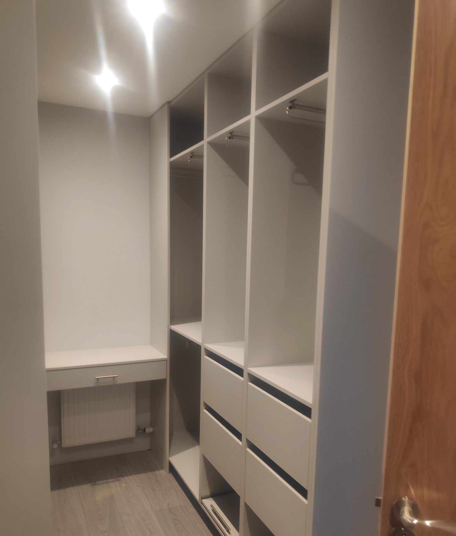 White walk-in wardrobe White walk-in wardrobe (finished) - fitted by Kitchen Hero