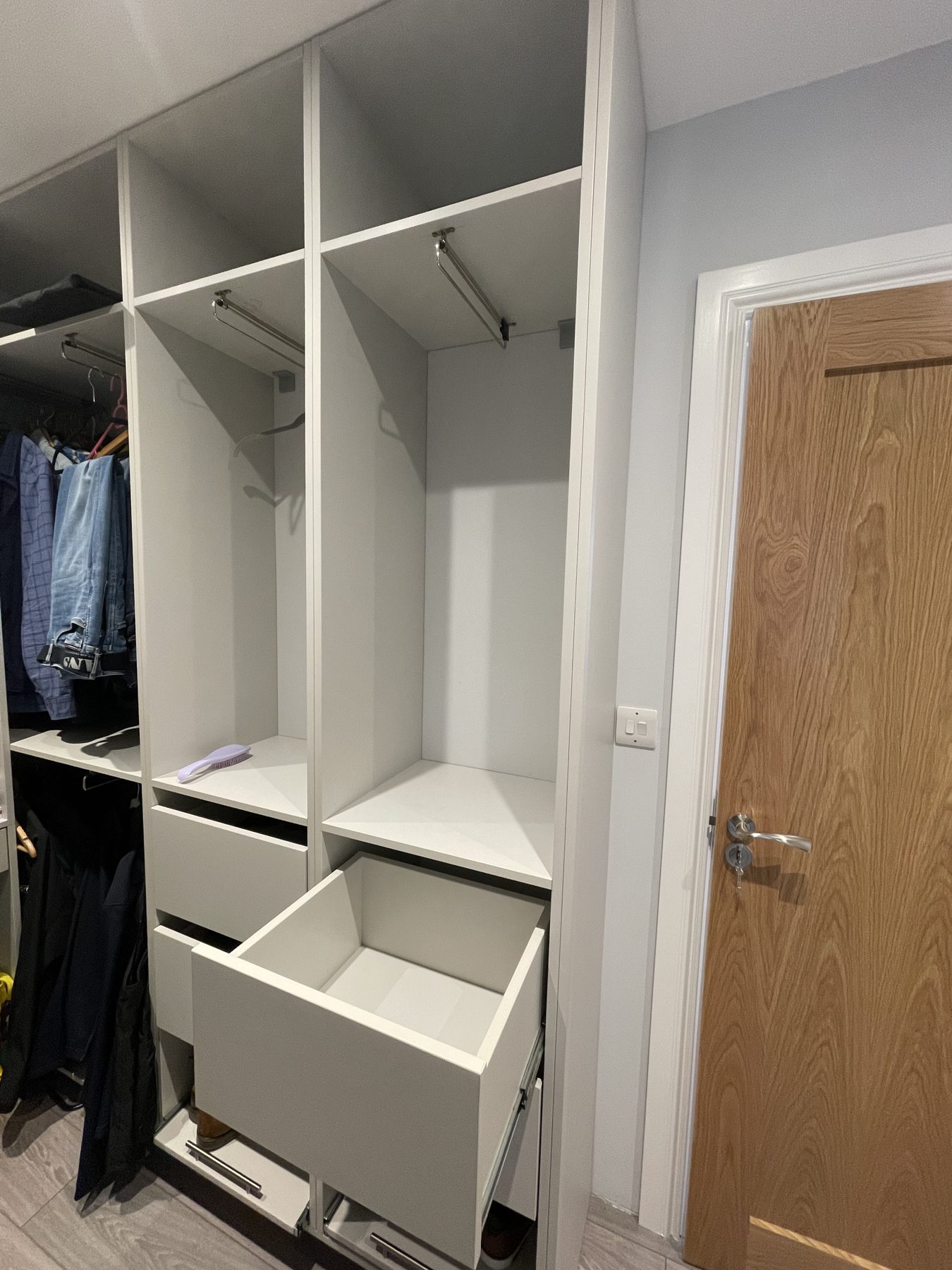 White walk-in wardrobe White walk-in wardrobe (finished) - fitted by Kitchen Hero