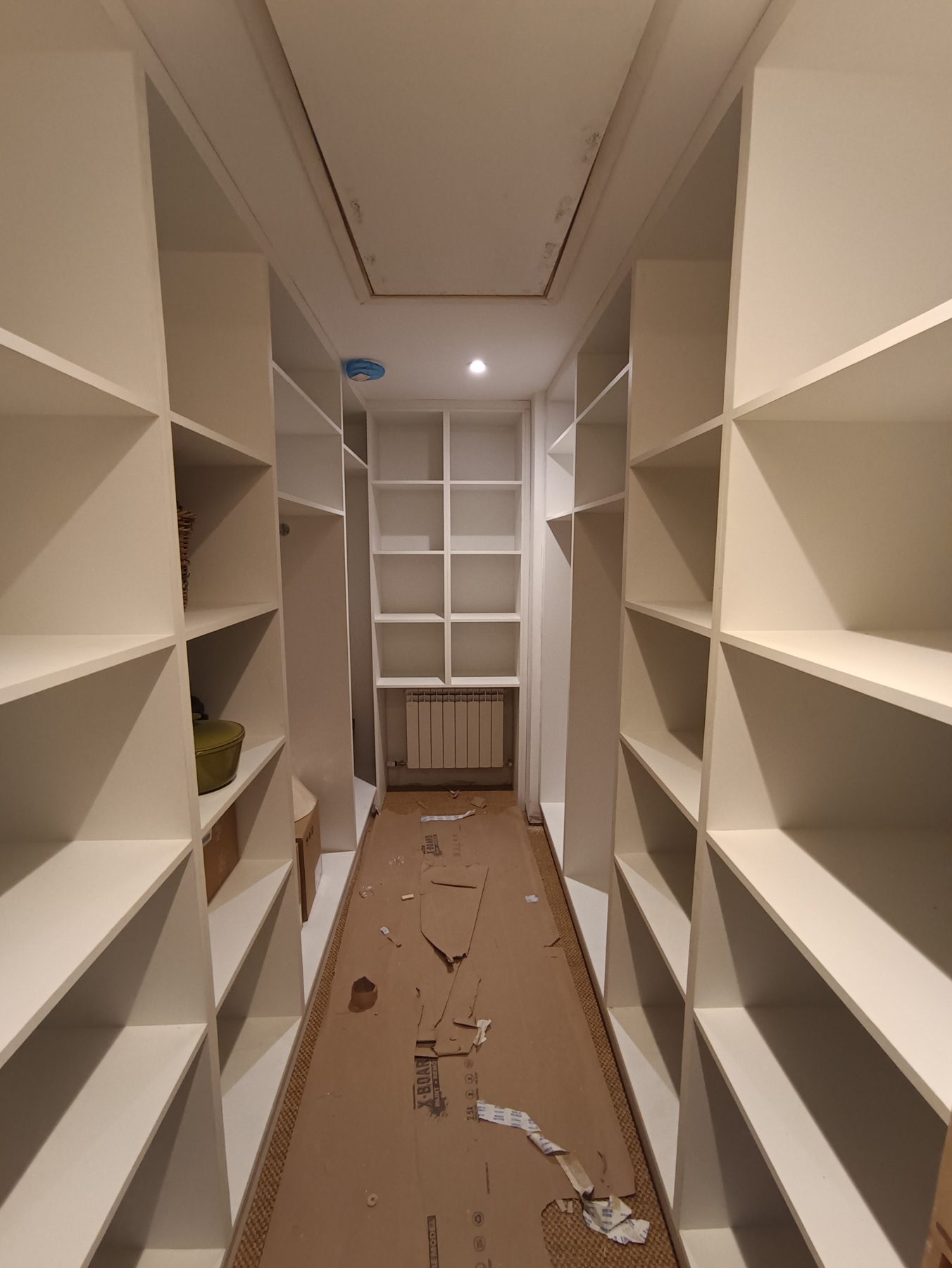 White walk-in wardrobe White walk-in wardrobe (mid-fit) - fitted by Kitchen Hero